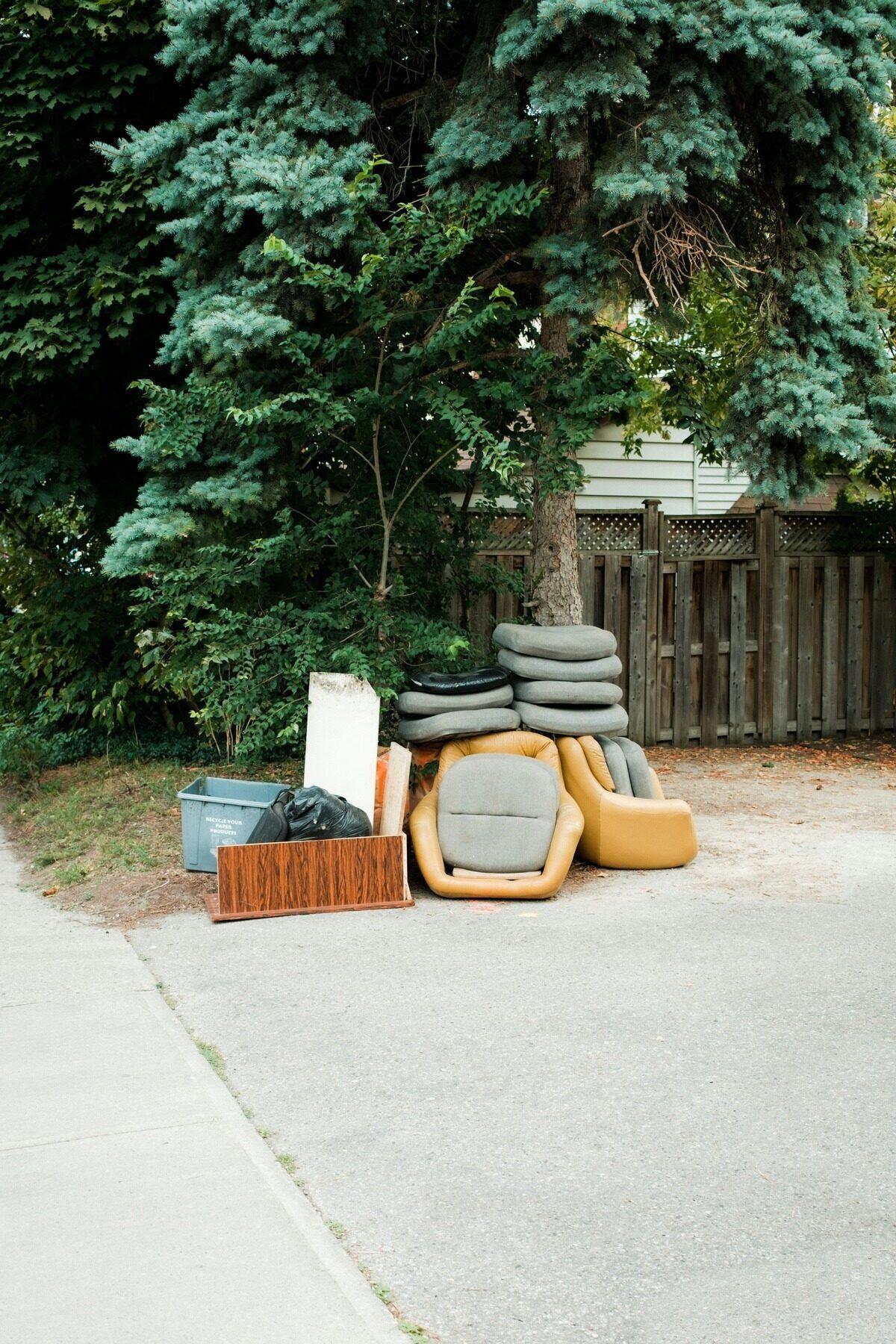 Old furniture set at the curb for removal