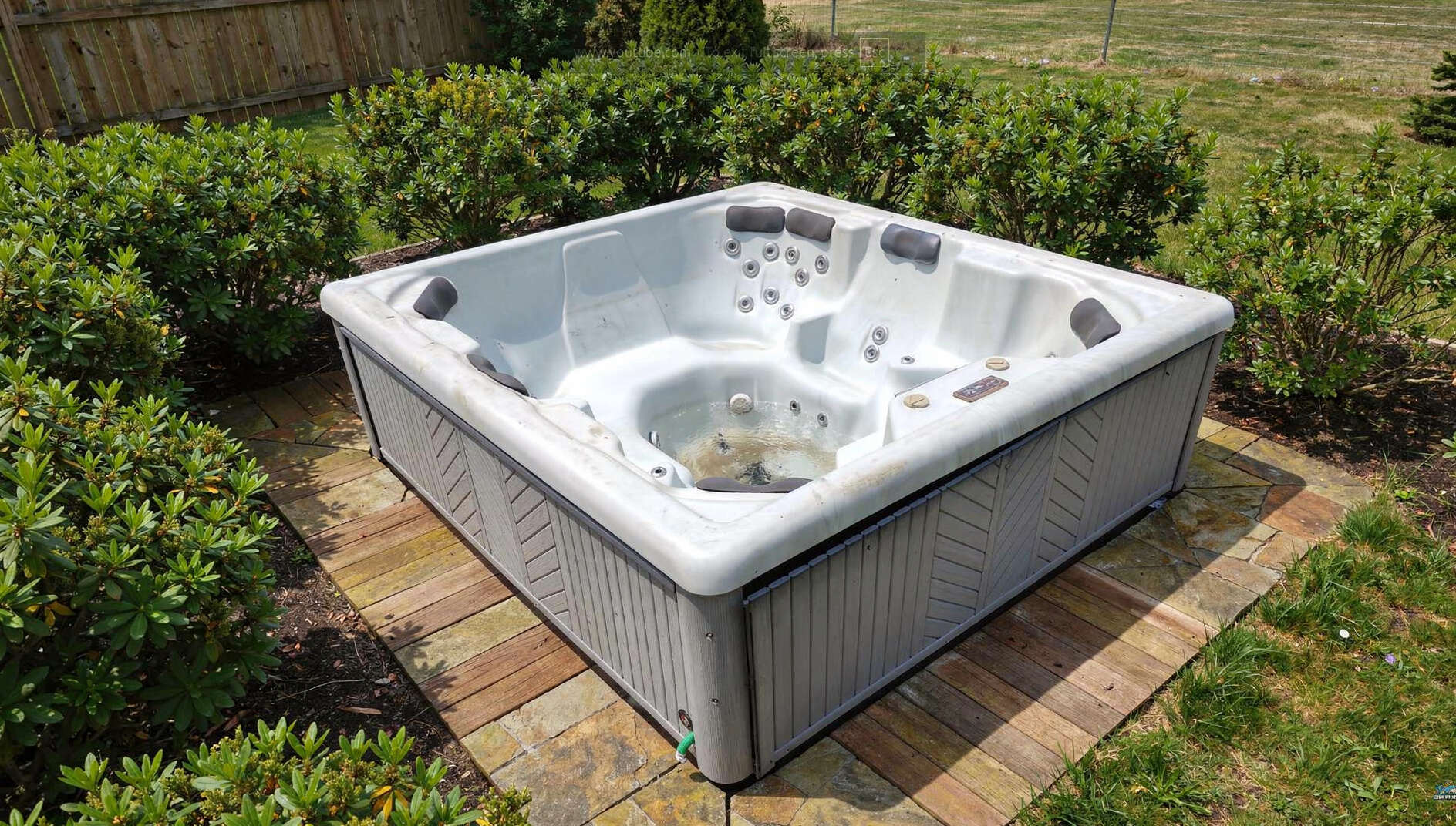 Outdoor hot tub on a backyard patio